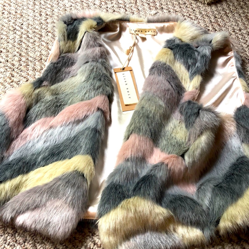 This is in perfect condition. Blush noir is on tags.